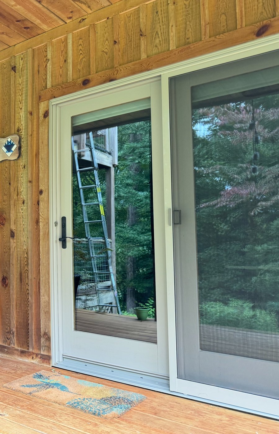 Clean sliding glass door and residential window detail after service
