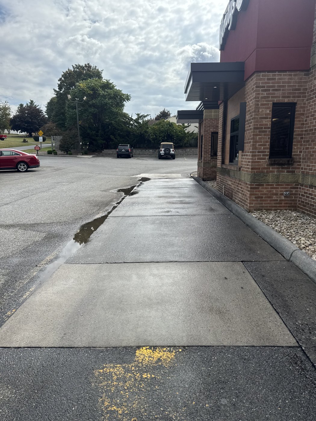 Clean commercial sidewalk and entry concrete after pressure washing service