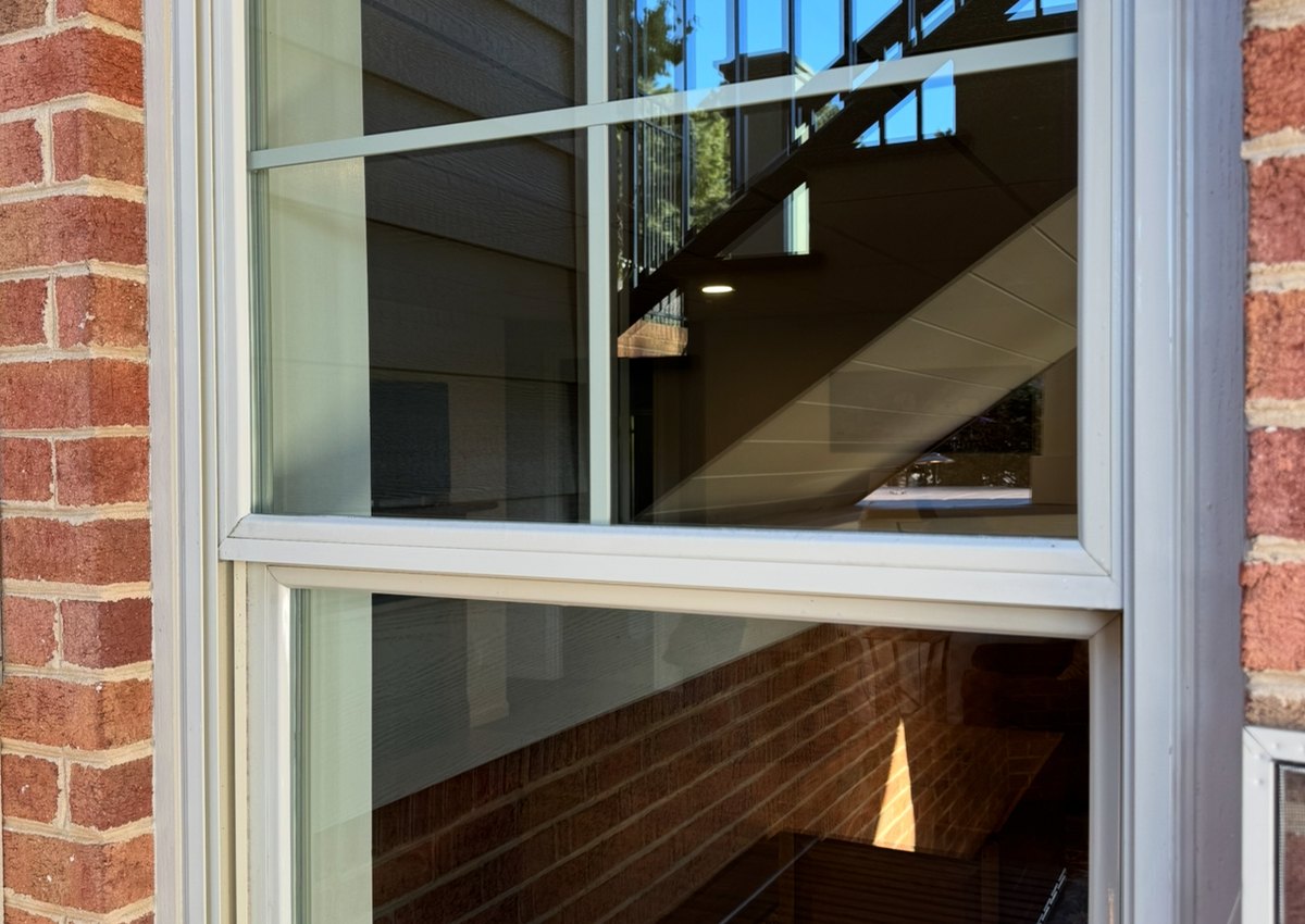 Close-up clean window glass on brick after professional window cleaning